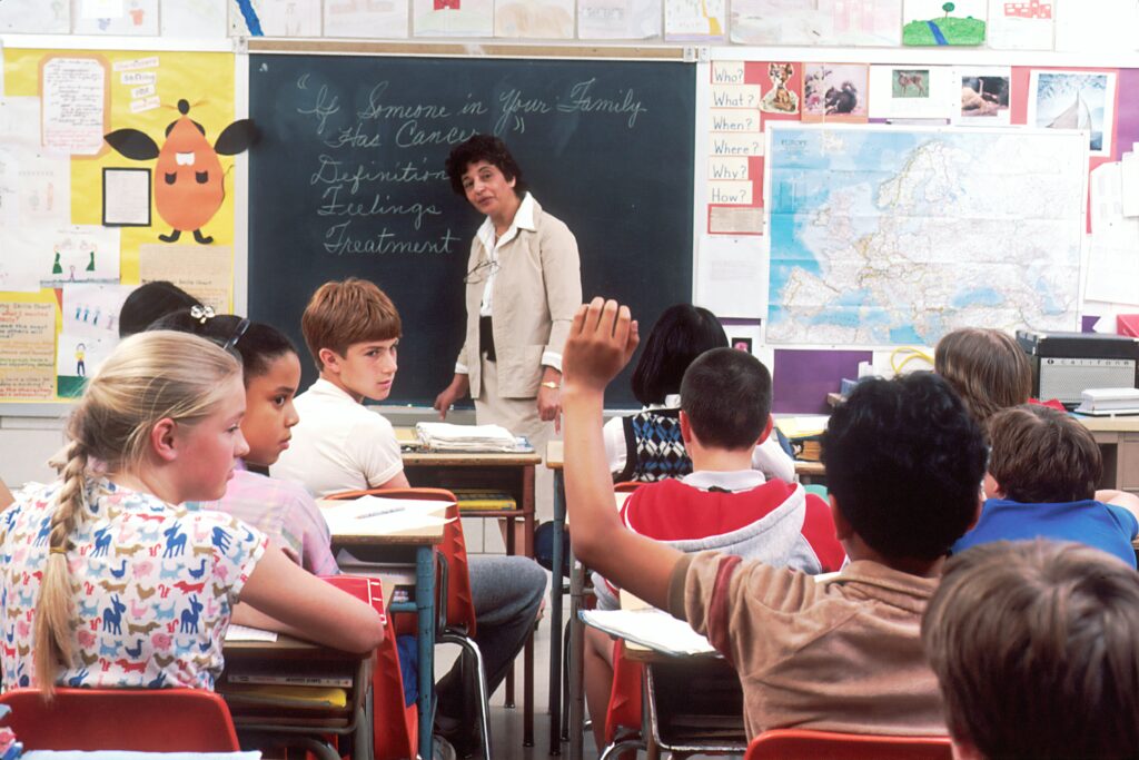 A teacher teaching English Language to class